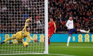 Alex Oxlade-Chamberlain scores the opening goal against Montenegro.