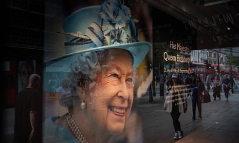 A shop window displaying a picture of Queen Elizabeth II.