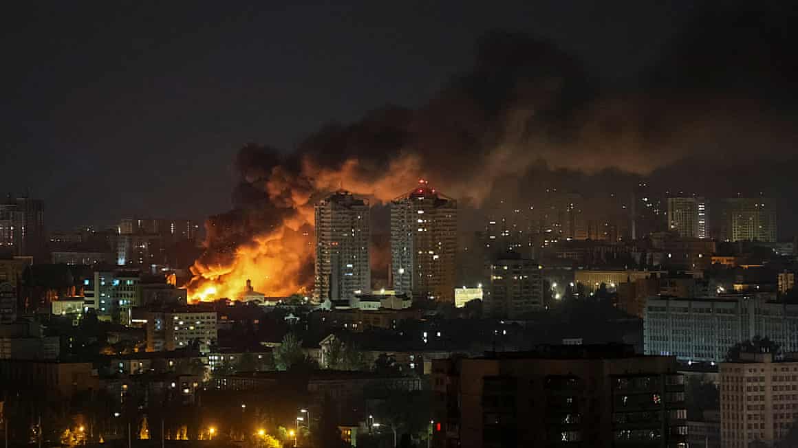 Fire and smoke in Kyiv after a Russian drone and missile strike.