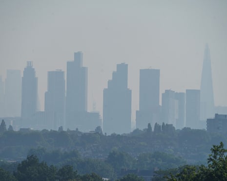 A view of the City of London skyline and financial in a heat haze this morning as the Met Office issue a red extreme heat warning.