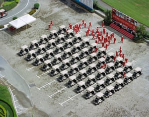 Caddies go to work at the Mission Hills golf course, Guangdong, China.