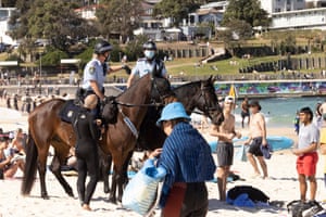 Mounted police patrol Bondi beach as part of public health order compliance operations on Sunday.