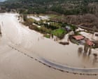 Powerful storms dump heavy rain and swell rivers across US Pacific north-west