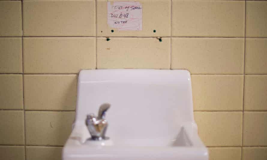A placard posted above a water fountain warns against drinking the water at Flint Northwestern High School in Flint, Michigan, May 4, 2016.