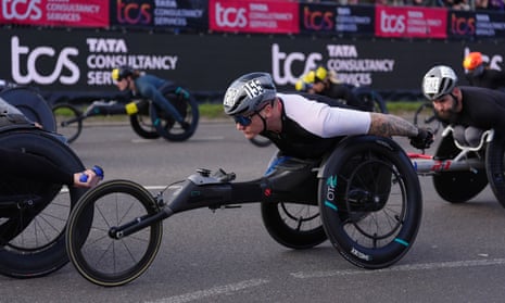 David Weir leaves the start of the elite wheelchair race during the London Marathon