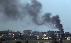 Smoke billows from targets in Tel Abyad, Syria, during bombardment by Turkish forces.