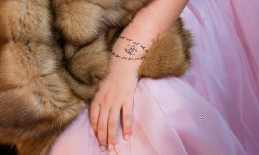 Fur enough: Elizabeth, 15, daughter of a Russian shipping magnate, dressed to appear in the Tatler Debutante Ball in Moscow, with a temporary Chanel tattoo.