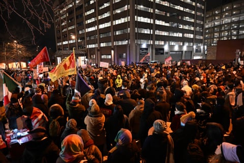 People protest in front of the ICE headquarters in downtown Washington DC on 24 January.