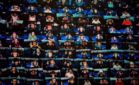 Players on TV screens during the final of the solo competition at the 2019 Fortnite World Cup in New York City, 2019.