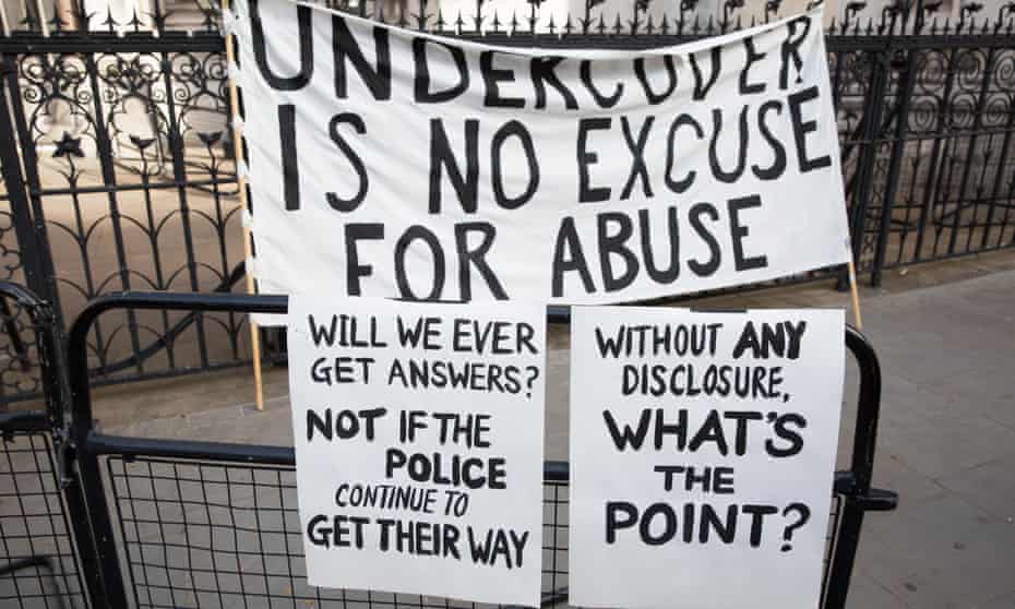 Banners protesting against undercover police outside the Royal Courts of Justice