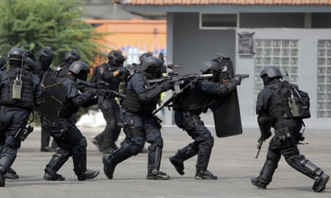 Indonesian police and military special forces take part in an anti-terrorism drill ahead of the 2018 Asian Games in Jakarta, Indonesia