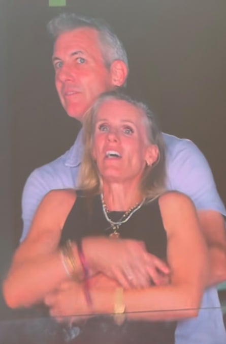 A man with his arms round a woman, caught on Jumbotron at a Coldplay concert in 2025