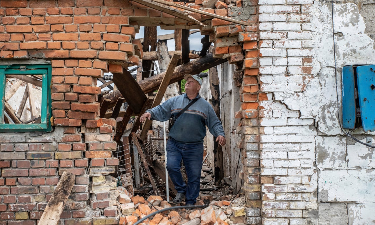 Ivan Mishchenko in the ruins of his farmhouse