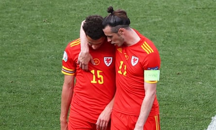 Gareth Bale consoles Ethan Ampadu after the defender was sent off in the second half.