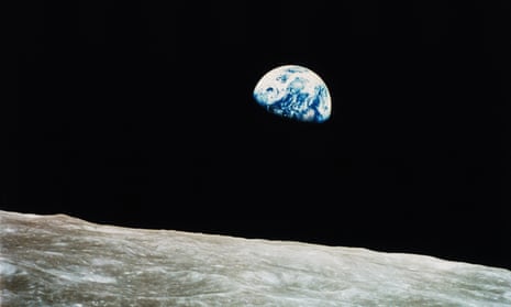 The Earth rises into view over the lunar horizon for the astronauts aboard Apollo 8 in 1968.
