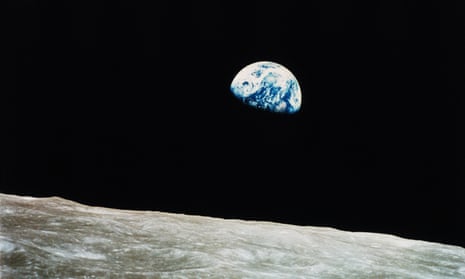 Earth rises over the lunar horizon