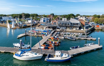 A yacht club, with piers and boats moored.