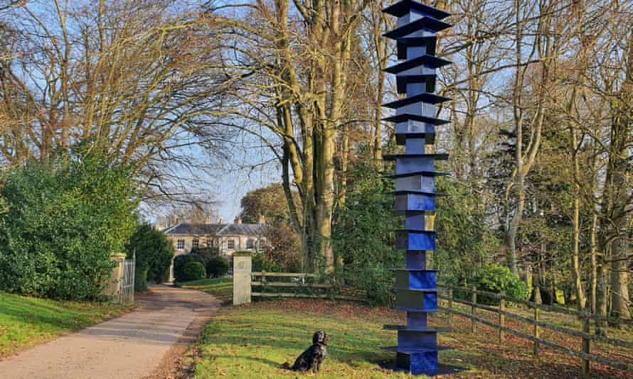 A narrow tall blue structure at the New Art Centre in Wiltshire.