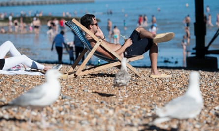 A man on Brighton beach enjoying Monday’s hot weather.