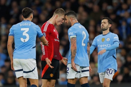 Manchester United’s Rasmus Hojlund and Manchester City’s Kyle Walker clash at the Etihad Stadium