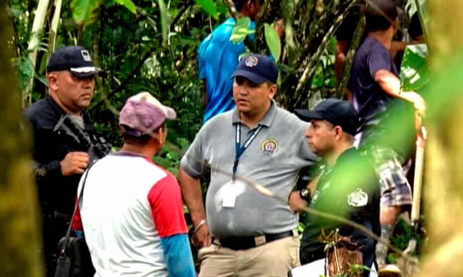Grab taken from the Panamanian channel TVN Noticias showing police and employees of the public ministry near the site where a mass grave was found with seven bodies at the indigenous region of Ngabé Buglé, in Bocas del Toro province, Panama, on 15 January.