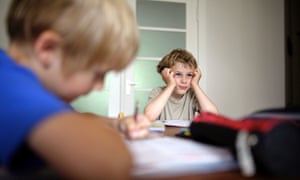 Two schoolboys studying