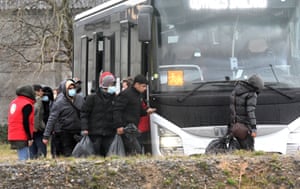Migrants leave a shelter in Calais, France