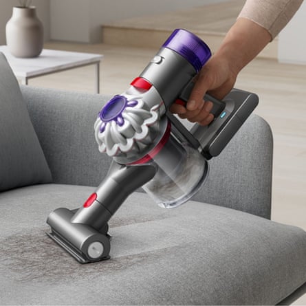Dyson CarBoat vacuuming pet hair off a sofa