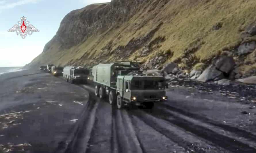A photo released by the Russian defence ministry shows Bastion missile launchers move to their positions on Matua island.