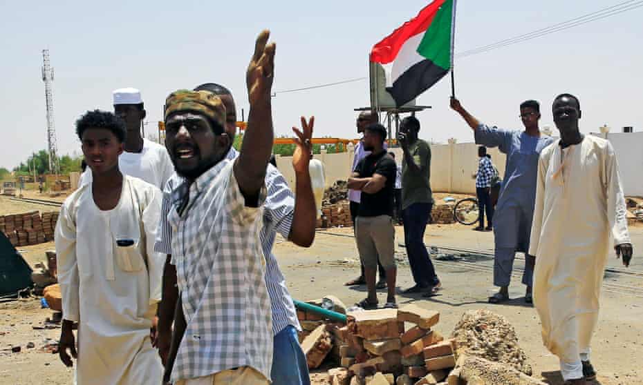 Sudanese protesters in Khartoum set up a barricade on a street, demanding that the country’s transitional military council hand over power to civilians
