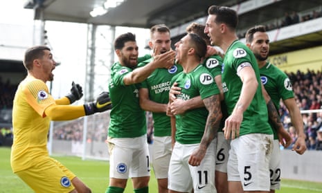 Knockaert’s teammates surround him after scoring Brighton’s second goal.