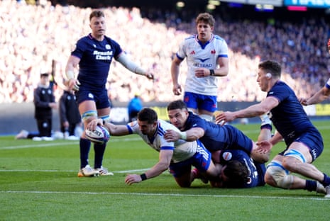 France's Thomas Ramos (left) scores his sides fourth try.