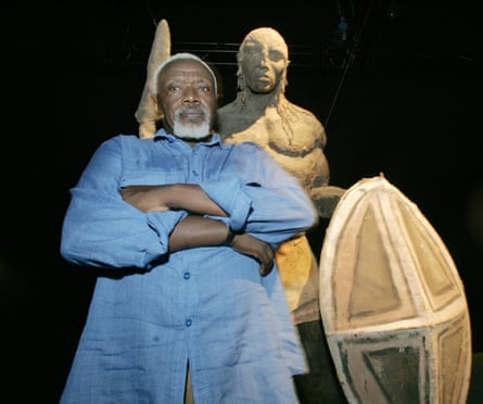 Ousmane Sow and one of his African figures before an exhibition near Nîmes, in southern France, in 2005