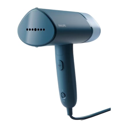 A handheld teal clothes steamer made by Philips