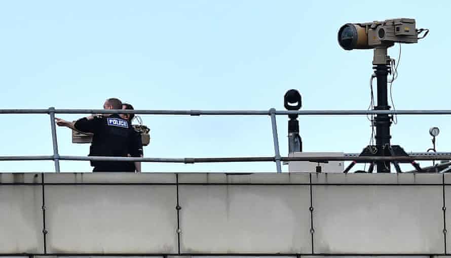 Police officers on a roof at Gatwick on 21 December 2018.
