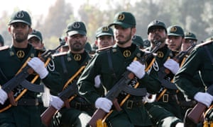 Members of Iran’s Revolutionary Guards march during a parade ceremony just outside Tehran.