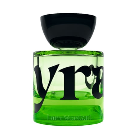 Bottle of green coloured perfume