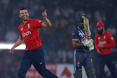 Mark Wood celebrates after taking the wicket of Babar Azam.