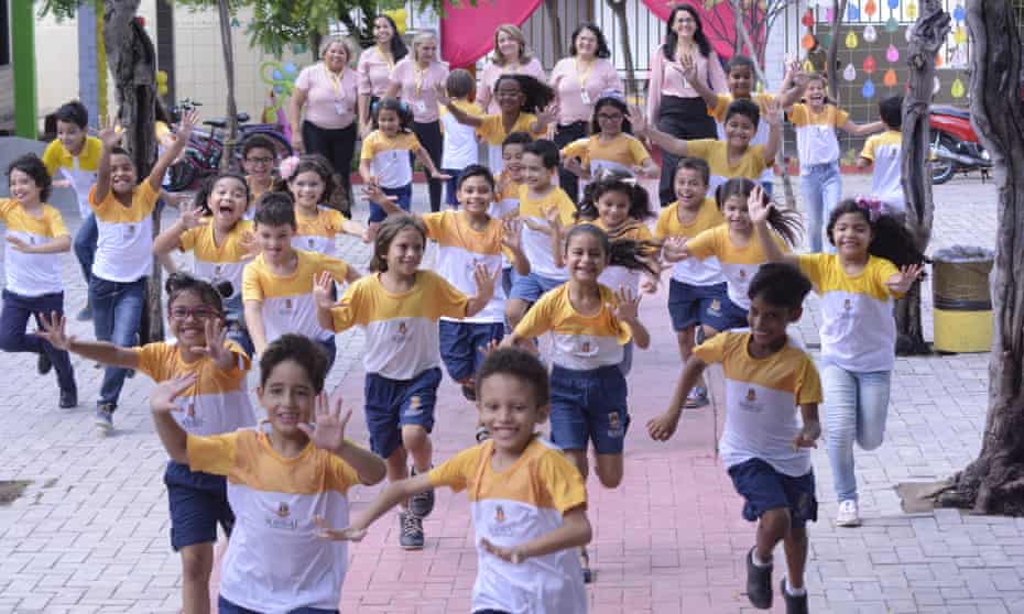 Happy schoolchildren running in Sobral