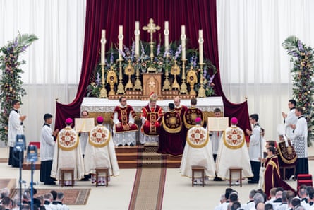 Altar with candles and priests
