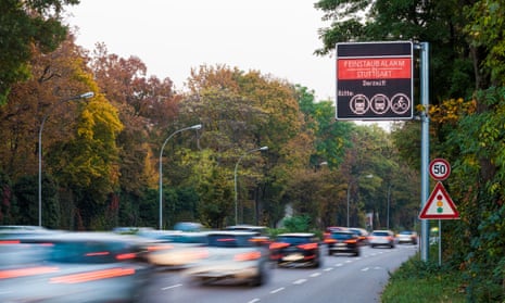Germany, Stuttgart, Warning sign for particulate pollution on highway