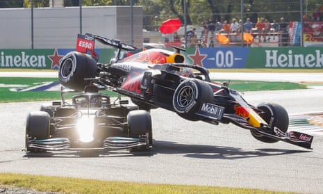 Max Verstappen’s car (right) flies into the air after colliding with Lewis Hamilton. 