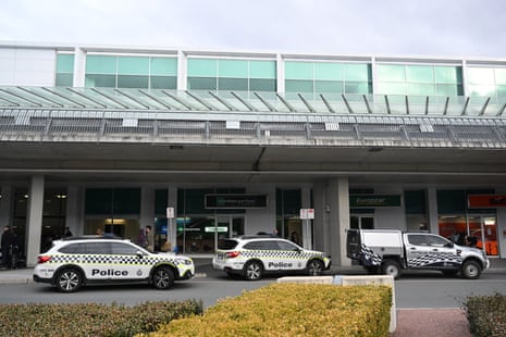 Police outside Canberra airport after a man fired shots.