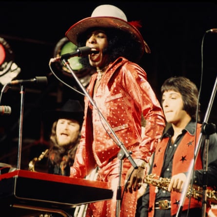Jerry Martini, Sly Stone and Gregg Errico playing on stage