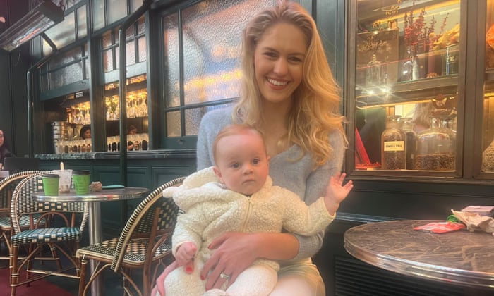 Ingrid Braithwaite with her baby sitting at a cafe table in Sydney's CBD