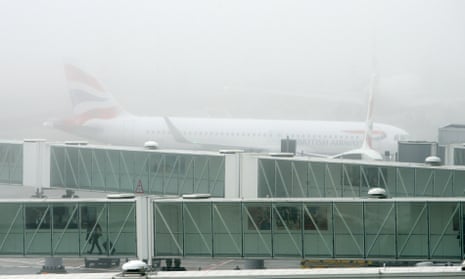 A British Airways plane in the fog at Terminal 5 of Heathrow Airport