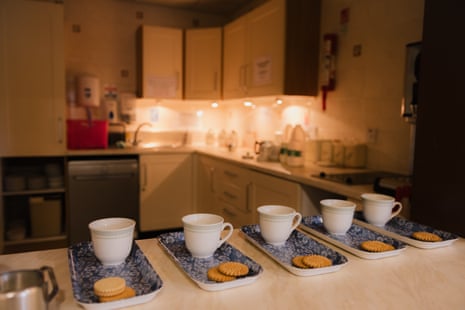 Mugs and biscuits on trays