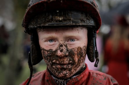 Jockey Sam Ewing from Ireland walks back to the weighing room after finishing unplaced in the Coral Cup on Tronador during racing on day two of the Cheltenham National Hunt jump racing festival at Cheltenham Racecourse on March 16th 2022 in Gloucestershire.