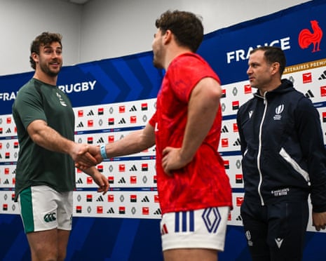 Ireland’s Caelan Doris (left) and Antoine Dupont, of France, shake hands in front of the referee Karl Dickson before the Six Nations opener at the Stade de France.