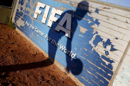 A kid collects a shot beside an artificial transportation astatine nan Football Centre for Hope successful Cape Town’s Khayelitsha township, 1 of respective built by Fifa successful South Africa successful nan run-up to nan 2010 World Cup